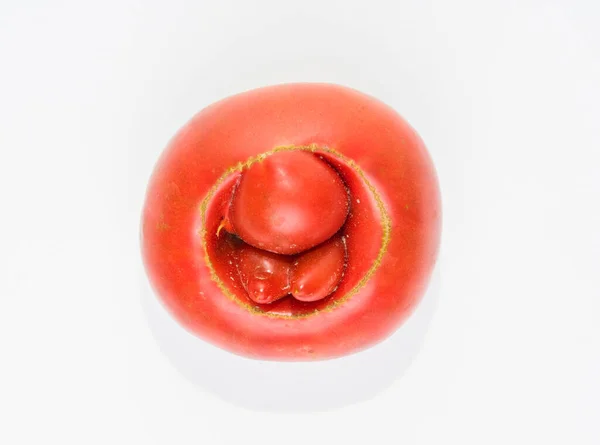 A deformed tomato that resembles hemorrhoids.