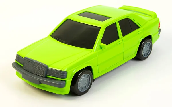 A light green car with tinted windows on a white background. Toy vehicles, outdoor games for children.