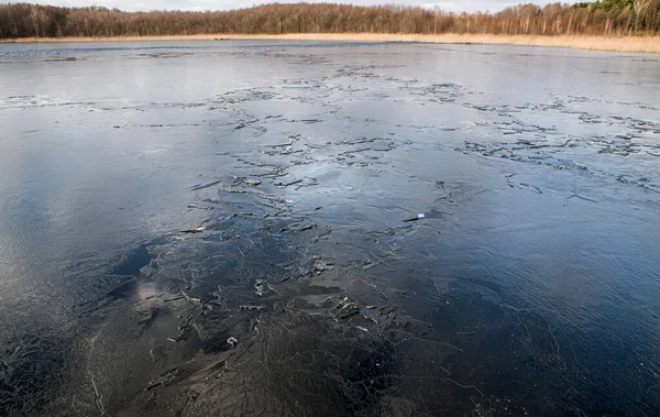Texture Thin Melting Ice Spring Lake Sky Reflected Surface Light — Stockfoto