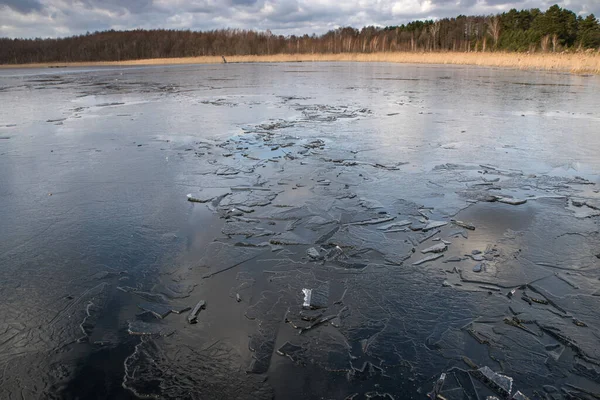 Spring Lake Covered Thin Transparent Cracking Ice — 스톡 사진