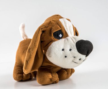 Soft children's toy dog on a white background.