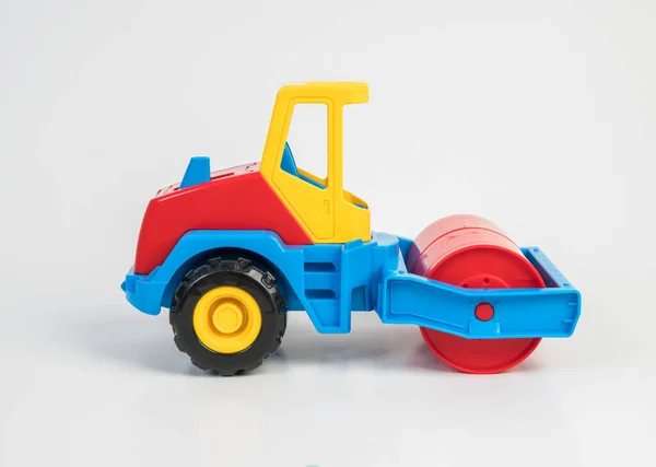 Plastic toy models of construction vehicles. Asphalt roller.