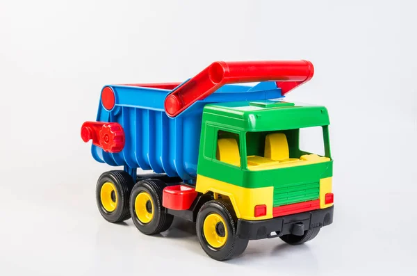 Camion Giocattolo Plastica Multicolore Giochi Bambini Uno Sfondo Bianco Dumper — Foto Stock
