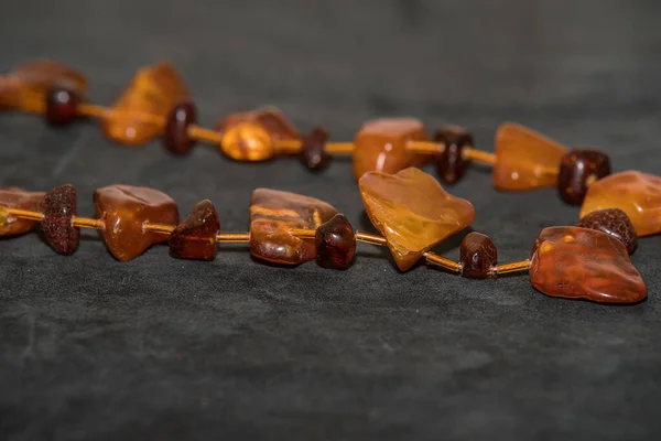 Jewelry made of natural amber stones. Selective focus.