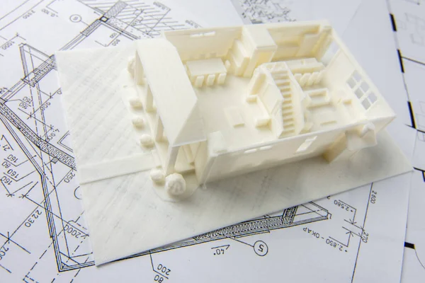 Top view of architectural 3D model of the house interior with furniture, doors, staircase and others details printed on a 3D printer with white filament by FDM technology