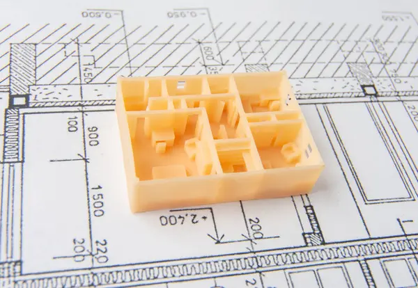 Top view of first floor of architectural 3D model of the house interior with furniture, doors, staircase and others details printed on a 3D printer with orange filament by SLA technology