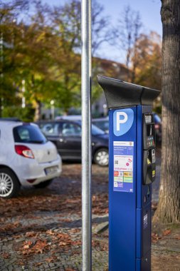 Berlin, Germany - October 30, 2022: Parking ticket machine to pay for a temporary parking space.