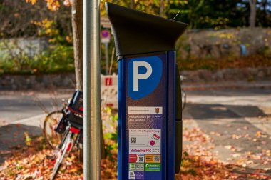 Berlin, Germany - October 30, 2022: Parking ticket machine to pay for a temporary parking space.