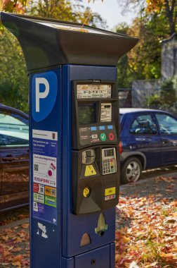 Berlin, Germany - October 30, 2022: Parking ticket machine to pay for a temporary parking space.
