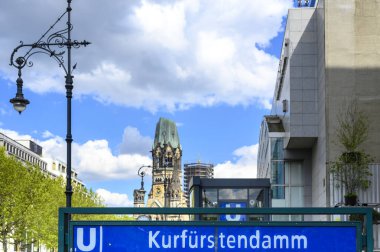 Kurfuerstendamm subway station in the center of Berlin with a view of the historic Kaiser Wilhelm Memorial Church. clipart
