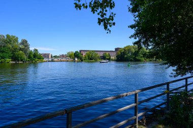 Scene on the Spree in Berlin-Treptow photographed from the banks of Treptower Park. clipart