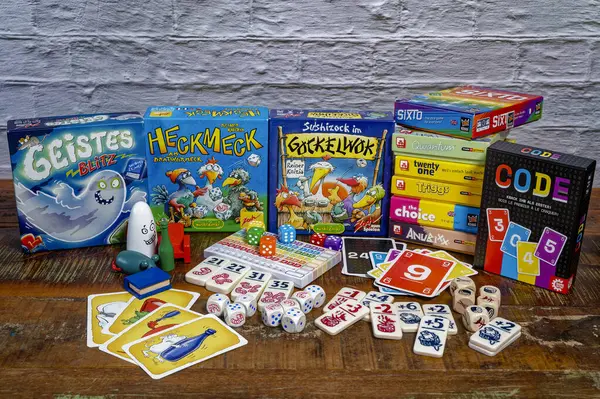 stock image Berlin, Germany - January 16, 2024: Various packs of parlor games with gaming accessories.