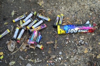 Berlin, Germany - January 1, 2023: Various remains of a New Year's Eve celebration along a street. clipart