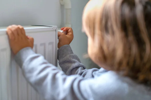 Small Child Who Gives More Heat Radiator Because — Stock Photo, Image