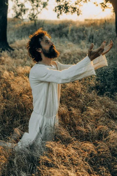 Jesus Christ Alone Garden Meditating Praying ストック写真
