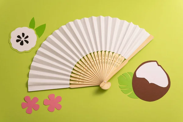 stock image Folding traditional white hand fan for summer mock-up. Green background