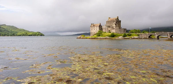 Photo of the Elian Donan Castle during a cloudy summer day in the Highlands, Scotland