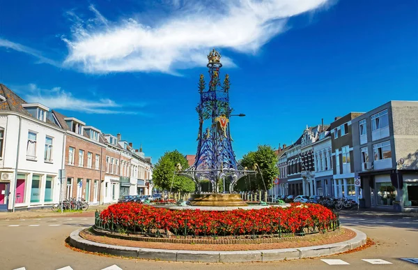 stock image Breda, Netherlands - August 30. 2023: City square with beautiful Wilhelmina fountain, colorful blooming flowers