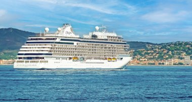 St. Tropez, France - June 9. 2016: Large luxury cruise ship Regent seven seas explorer in mediterranean sea bay on cote d azur cruise clipart
