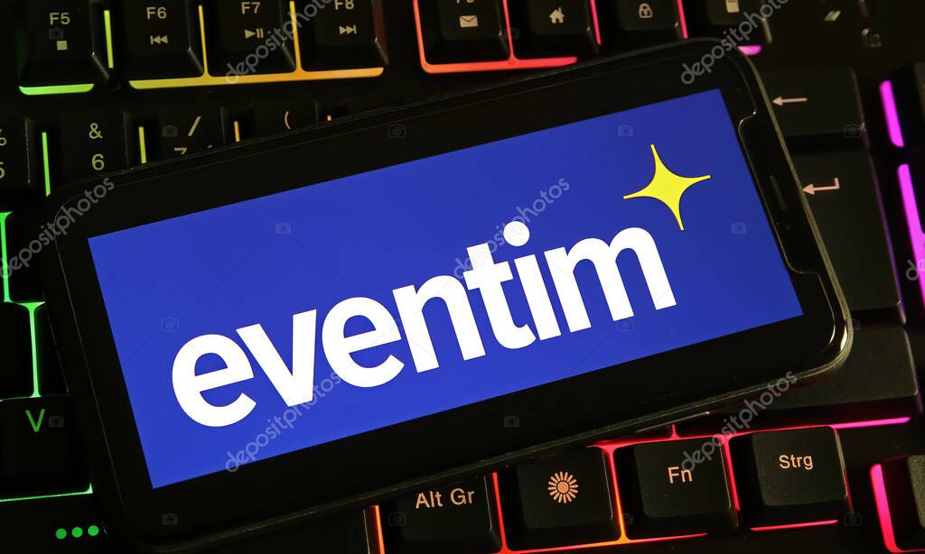 Viersen, Germany - December 9. 2023: Closeup of smartphone on computer keyboard with logo lettering of Eventim ticket service