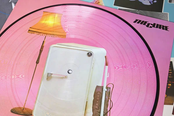 stock image Viersen, Germany - May 9. 2023: The Cure band vinyl picture disc pink record album Three imaginary boys, retro fridge and Hoover vacuum cleaner from 1979 (focus on center)