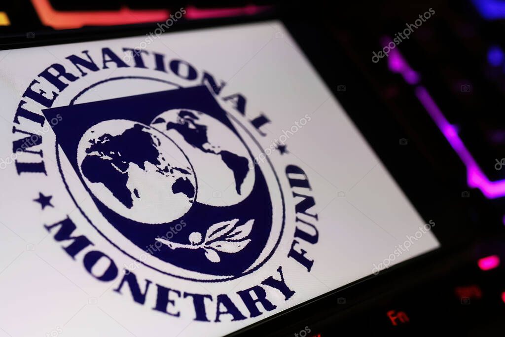 Viersen, Germany - January 9. 2024: Smartphone screen with logo lettering of IMF international monetary fond on computer keyboard