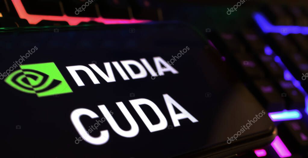 Viersen, Germany - March 1. 2024: Closeup of smartphone screen with logo lettering of Nvidia Cuda on computer keyboard