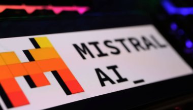 Viersen, Germany - March 9. 2024: Closeup of smartphone on computer keyboard with logo lettering of Mistral AI large clipart