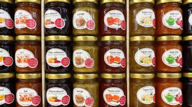 Viersen, Germany - May 9. 2024: Closeup of many jars Wolfram Berge delicatessen sauces and jam in german store clipart