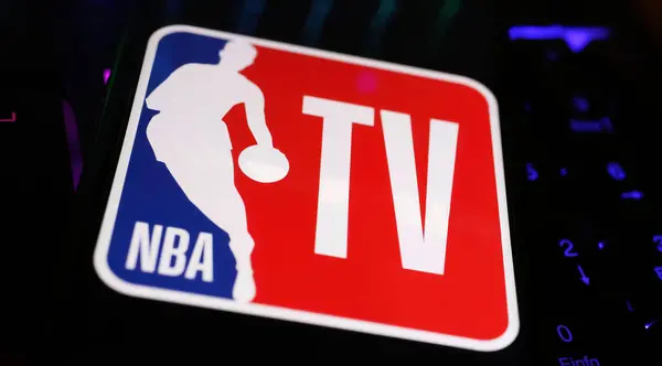 stock image Viersen, Germany - May 1. 2024: Closeup of smartphone with logo lettering of NBA TV on computer keyboard