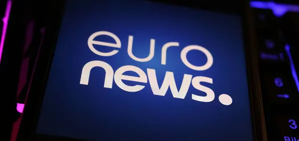 stock image Viersen, Germany - May 1. 2024: Closeup of smartphone with logo lettering of Euronews TV channel on computer keyboard