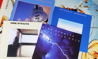 Viersen, Germany - May 9. 2024: Closeup of collection british rock band Dire Straits record album covers clipart