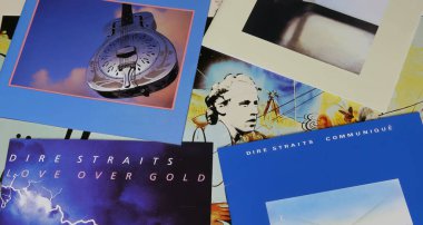 Viersen, Germany - May 9. 2024: Closeup of collection british rock band Dire Straits record album covers clipart