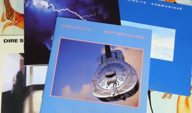 Viersen, Germany - May 9. 2024: Closeup of british rock band Dire Straits record album covers with Brothers in Arms in center clipart