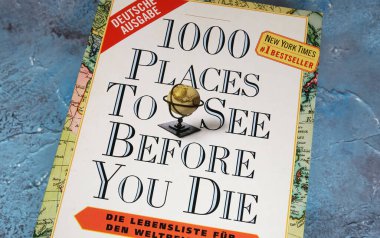 Viersen, Germany - May 9. 2024: Closeup of Patricia Schultz book cover 1000 places to see before you die, a traveller bucket list clipart