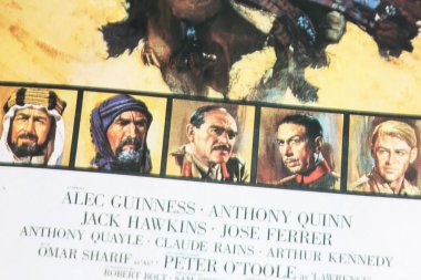 Viersen, Germany - May 9. 2024: Cinema film poster detail from classic movie Lawrence of Arabia with Alec Guinness, Anthony Quinn, Jack Hawkins,  Jose Ferrer from 1962 (focus on center) clipart