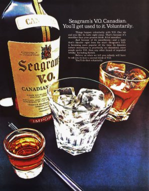 Viersen, Germany - March 9. 2023: Closeup of vintage Seagram canadian whisky advertising in american magazine from 60s (focus on lower third) clipart