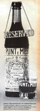 Viersen, Germany - May 9. 2024: Old american retro magazine Punt e Mes italian vermuth advertising from 1960s (focus on center of bottle) clipart