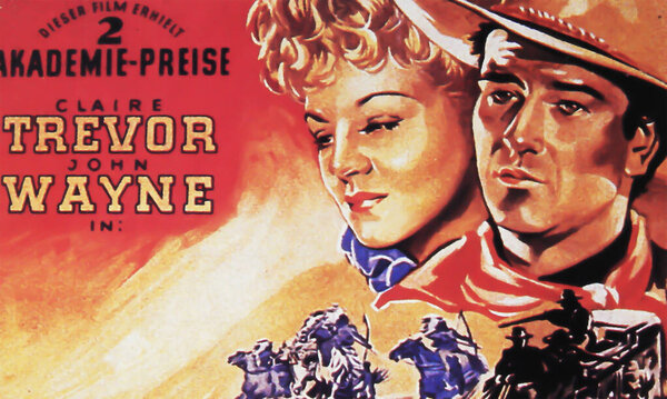Viersen, Germany - May 9. 2024: Stagecoach western film cinema poster detail (German version) with John Wayne and Claire Trevor from 1939 (focus on center)