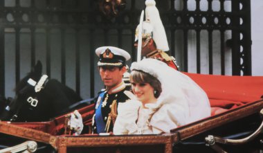 Viersen, Germany - July 9. 2024: Historical magazine photo with Prince Charles and Lady Diana return to Buckingham Palace in carriage after wedding 1981 (focus on lower third) clipart