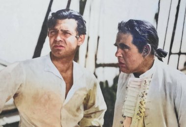 Viersen, Germany - July 9. 2024: Mutiny on the Bounty film lobby card detail with Charles Laughton and Clark Gable from 1935 (focus on persons in front) clipart