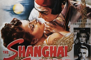 Viersen, Germany - July 9. 2024: The Shanghai Gesture cinema film poster detail with Gene Tierney and Walter Huston from 1941 (focus on center) clipart