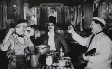 Viersen, Germany - July 9. 2024: Old magazine photo of Stan Laurel, Oliver Hardy, Mae Busch in film Them Thar Hills  from 1934 (focus on) clipart