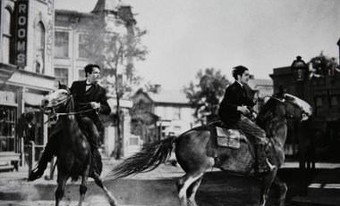 Viersen, Germany - July 9. 2024: Old magazine photo of horse riding men Henry Fonda and Tyrone Power in Jesse James film from 1939 (focus on left rider) clipart