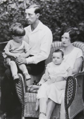 Viersen, Germany - July 8. 2024: Old magazine photo of Buster Keaton with first wife Natalie Talmadge and two sons 1920s (focus on upper central person) clipart