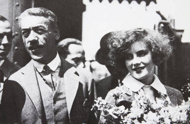 Viersen, Germany - July 8. 2024: Old magazine photo of Greta Garbo with swedish film director Mauritz Stiller in Los Angeles 1925 (focus on right person) clipart