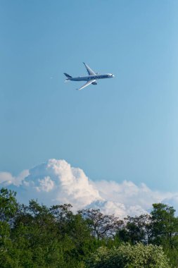 Helsinki, Finland - 9 June 2017: Finnair Airbus A350 XWB airliner flying in extremely low altitude over small island in the Helsinki archipelago at the Kaivopuisto Air Show.