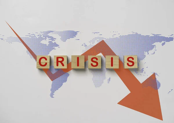 Crisis wording on world map with red decreasing graph for world crisis concept from epidemic disease and economic recession.