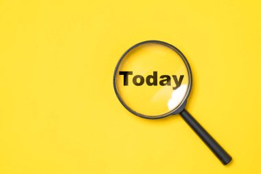 Today wording inside of Magnifier glass on yellow  background for focus current situation , positive thinking mindset concept.