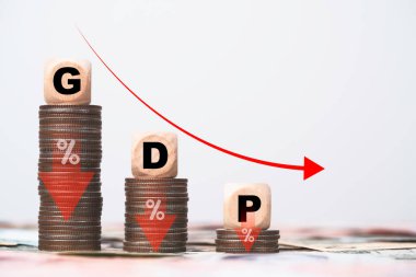 GDP or Gross Domestic Product wording on decreasing coins stacking and red down arrow for economic recession concept. clipart